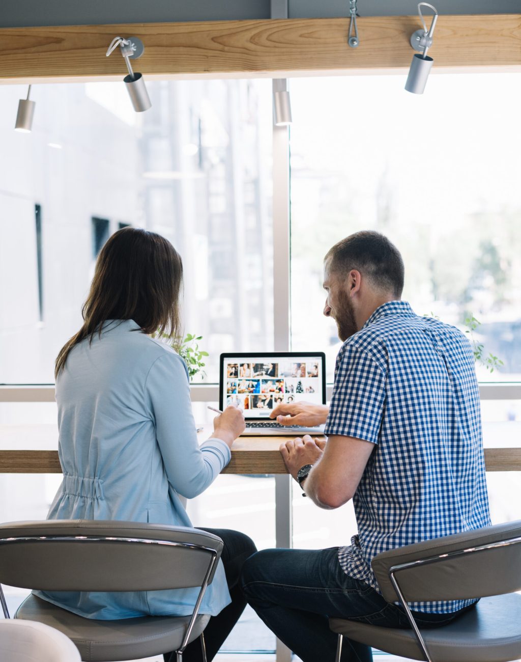 back-view-colleagues-working-laptop